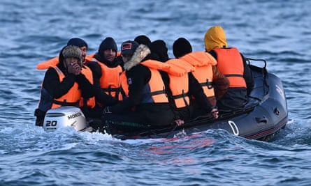 Migrants cross the English channel in an inflatable boat.