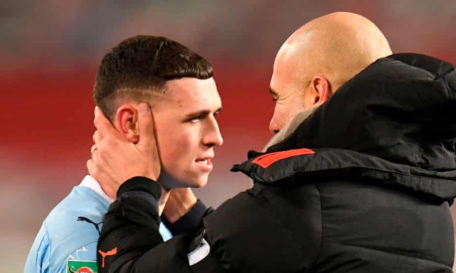 Phil Foden with Manchester City’s manager Pep Guardiola.