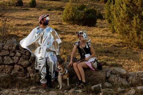 Artists use self-made artefacts to observe a solar eclipse before totality near the small village of Castell de Cabres, Spain
