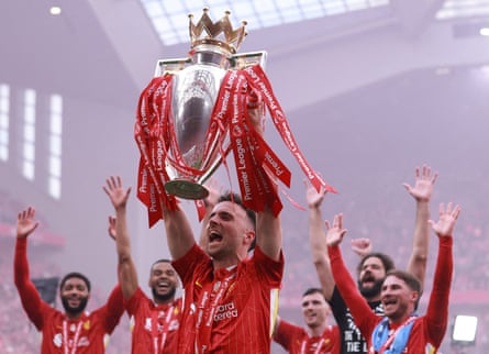 Diogo Jota lifts the Premier League trophy in May.