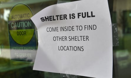 A sign is posted on a door at a hurricane shelter in Naples, Florida on Saturday.