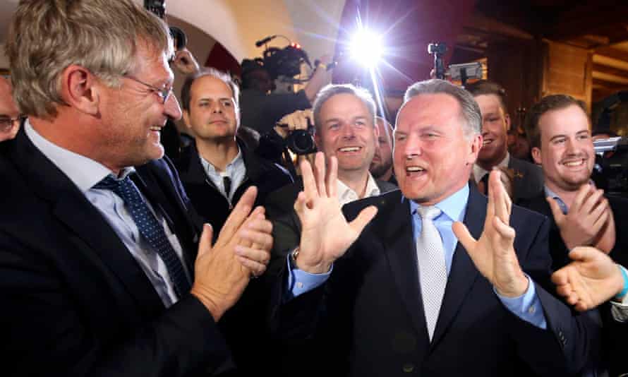The AfD’s Georg Pazderski and Joerg Meuthen celebrate the first exit polls of the Berlin city-state election.