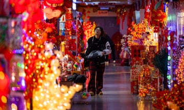 A woman walking through the Christmas wholesale market in Yiwu