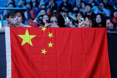 Fans film China women’s match against Romania