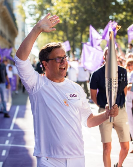 ‘Immensely proud’: Paul Hudson with the Olympic torch.