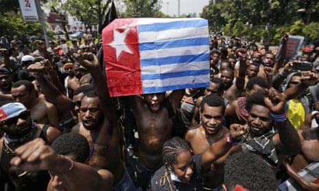 A Papuan activist holds up a separatist 'Morning Star' flag during a rally in 2019. 