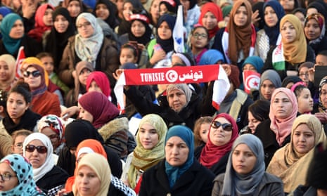 Tunisian women take part in a rally, held to mark the fifth anniversary of the 2011 revolution, on Habib Bourguiba Avenue in Tunis in January 2016