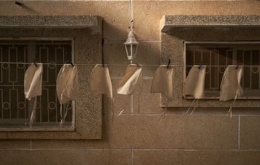 White cotton headpieces on clothesline, 2022