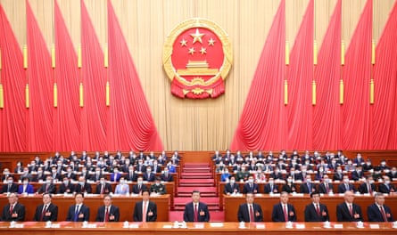 China's President Xi Jinping (C) and other Chinese leaders attend the closing meeting of the first session of the 14th National People's Congress in 2023.