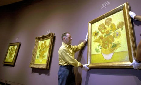 Golden glow … three versions of Van Gogh’s sunflowers are hung in Amsterdam, 2002.
