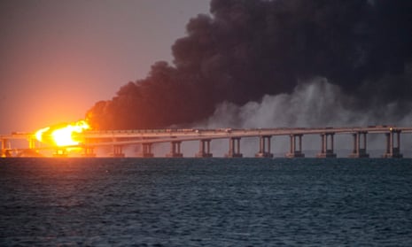 Flames and smoke rising from the Kerch bridge between Russia and Crimea