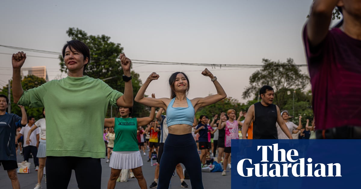 ‘There’s more to life than work’: Bangkok’s young people embrace mass outdoor aerobics sessions