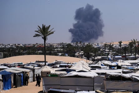 Smoke rises from an Israeli airstrike south of Khan Younis, Gaza, on 21 May.