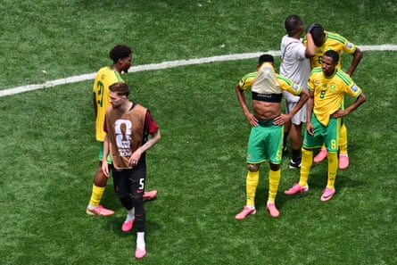 South Africa’s midfielder Thalente Mbatha covers his face with his shirt after Canada’s late win.