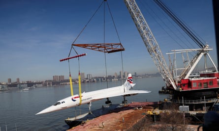 The Concorde supersonic jet is lifted from a barge to its resting place at the Intrepid Museum in New York City.