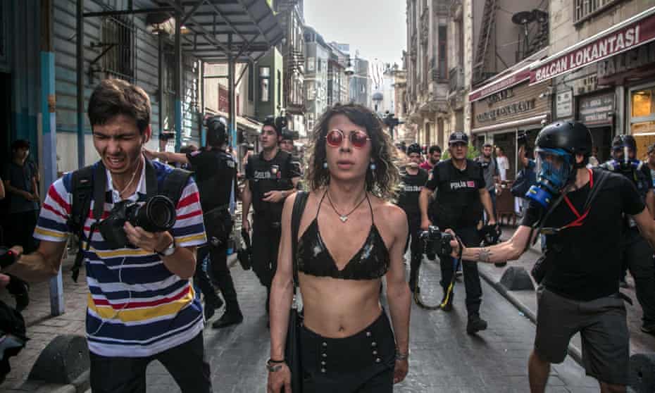 Turkish anti-riot police officers attempt to disperse demonstrators gathered for a rally staged by the LGBT community on Istiklal Avenue in Istanbul.