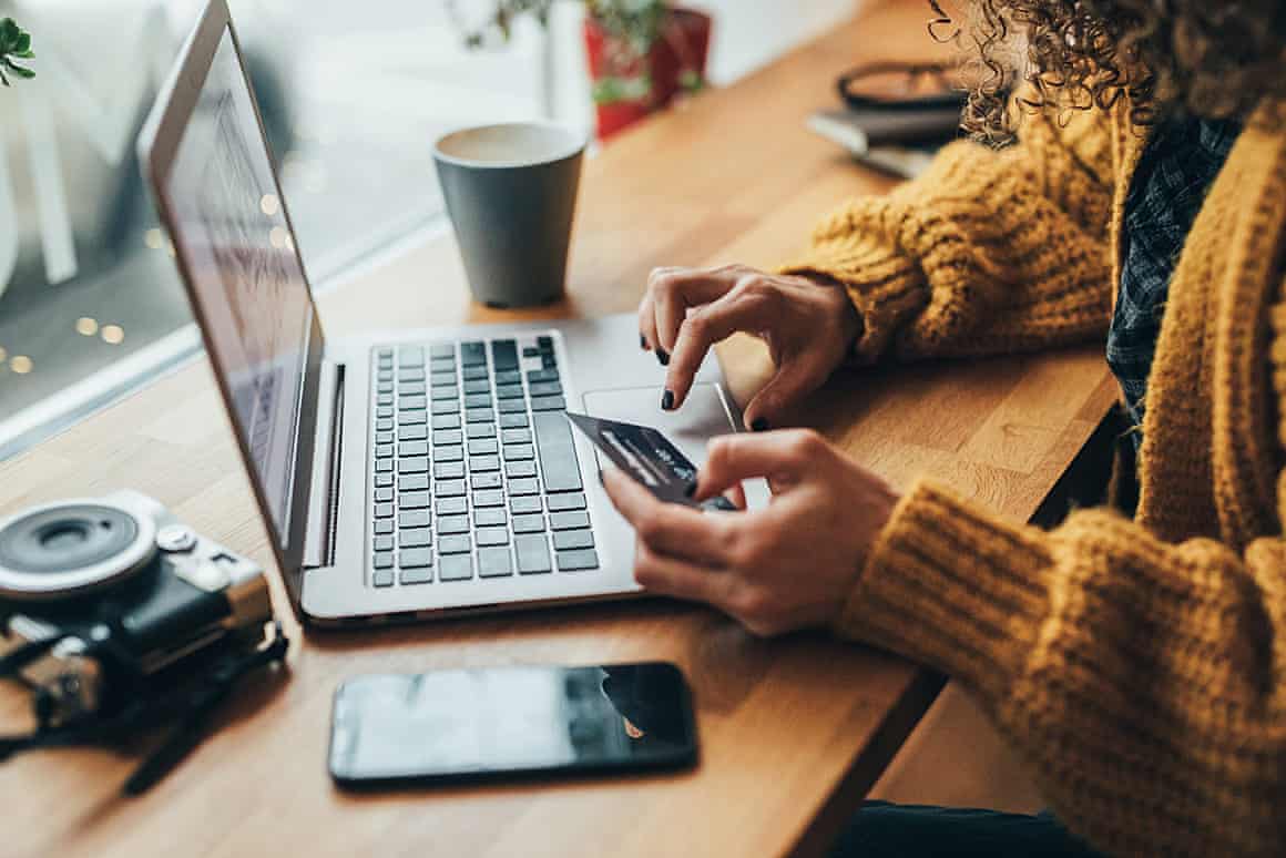 A woman shopping online with laptop