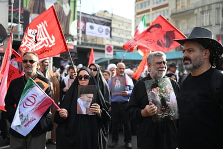 People gather at Ferdowsi Square for the funeral procession of Khamenei in Tehran on 6 July.