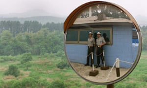 South Korean soldiers at a guard station look out at North Korean territory outside the demilitarized zone that separates the two halves of the Korean peninsula.t