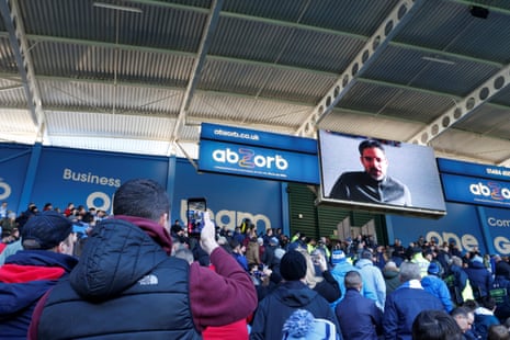 Huddersfield Town fans watch a message from David Wagner.