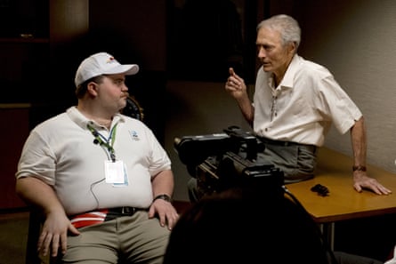 Clint Eastwood speaks with actor Paul Walter Hauser as they work during the filming of Richard Jewell.