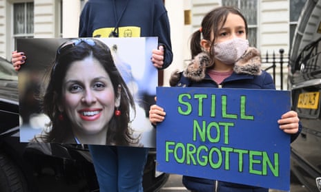 Nazanin Zaghari-Ratcliffe’s daughter Gabriella holds a placard outside the Iranian Embassy in March 2021. She is still being held in Tehran despite finishing her five-year sentence.