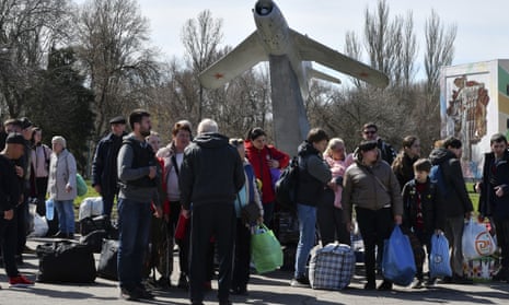 People wait to board a bus during their evacuation in Kramatorsk, Ukraine, on 9 April.