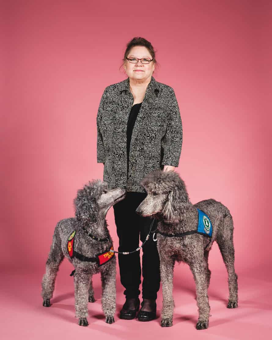 Laura Falteisek with Jodie and Titan, trained service dogs.