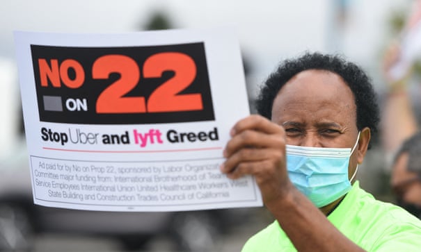 A driver holds up a sign supporting a no vote on Prop 22 in Oakland last year. The ruling sets up a fight that could likely end up in California’s supreme court. Photograph: Josh Edelson/AFP/Getty Images A driver holds up a sign supporting a no vote on Prop 22 in Oakland last year. The ruling sets up a fight that could likely end up in California’s supreme court. Photograph: Josh Edelson/AFP/Getty Images