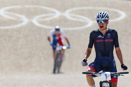 Pidcock celebrates victory as he crosses the finish line ahead of France’s Victor Koretzky.