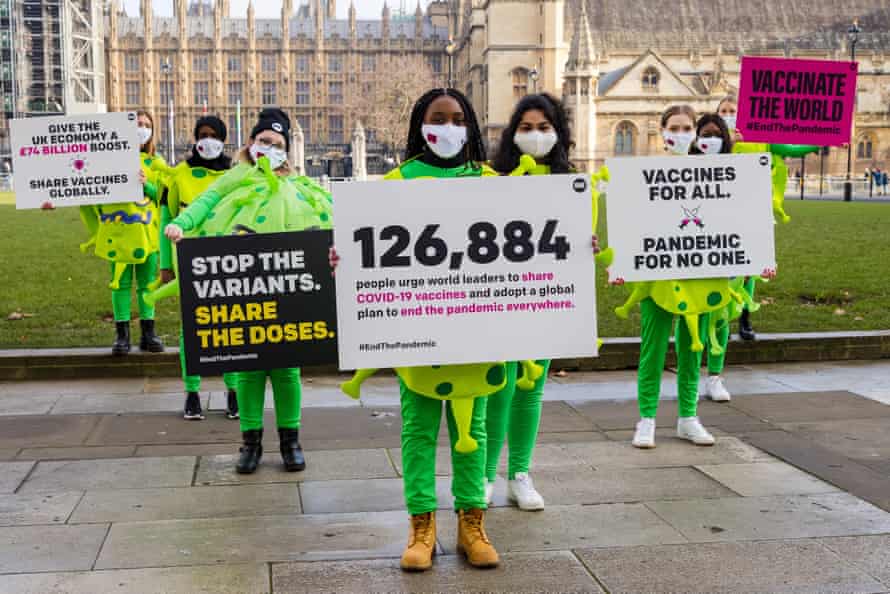 Activists from anti-poverty ONE Campaign at Westminster today staging a protest calling for the sharing of coronavirus vaccines with developing countries.