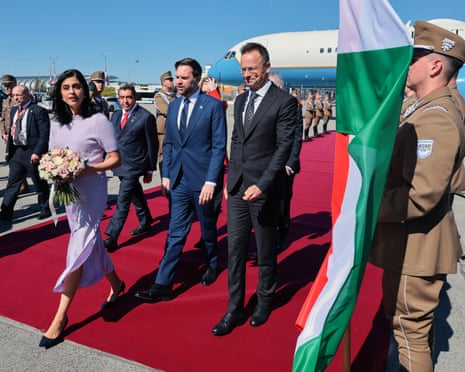 Hungarian foreign minister Péter Szijjártó, right, welcomes US vice-president JD Vance and second lady Usha Vance as they arrive at Budapest Ferenc Liszt International Airport in Budapest, Hungary.