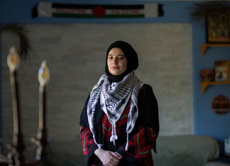 a woman poses for a photograph