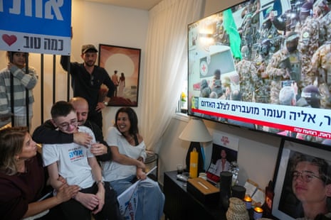 Relatives and friends of Eliya Cohen, 27, watch the TV broadcast of his release by Hamas in Gaza, in Tel Aviv, Israel.
