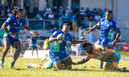 Michael Naitokani of Fijian Drua runs with the ball gainst Moana Pasifika