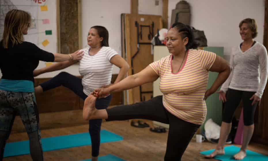Women are put through their poses by instructors at Ourmala’s course in Hackney, east London 