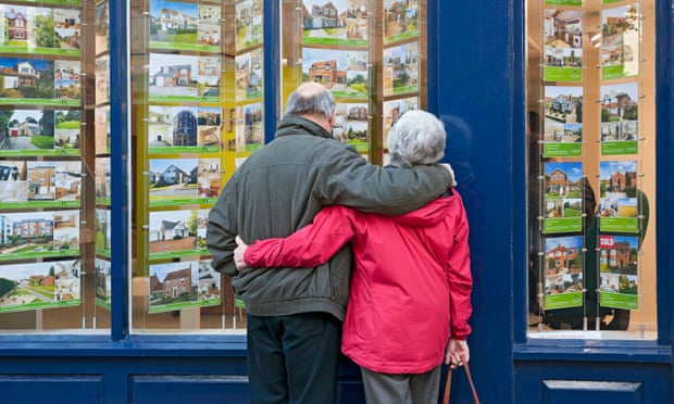 Older couple looking in estate agent's window York