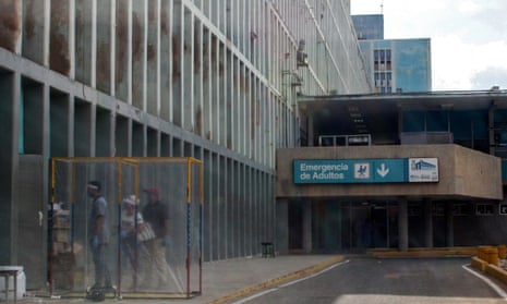 People line up to enter the emergency room of Maracaibo’s University hospital on 2 July. 