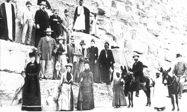 English tourists climbing a pyramid during Thomas Cook tour of Egypt, 19th, early 20th Century. 