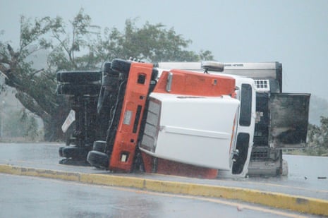 An overturned truck is seen on a highway following the passing of Hurricane Roslyn that hit the Mexico's Pacific coast on Sunday.