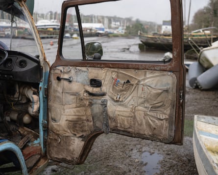 The lining of the door of the van is upholstered in old jeans, the pockets of which hold objects such as pens.