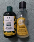 Bottles of Body Shop banana shampoo and conditioner.