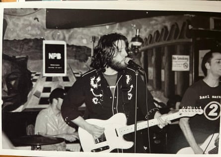 Patrick Freyne singing and playing guitar.