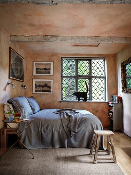 Cottage industry: reclaimed lead windows in the bedroom.