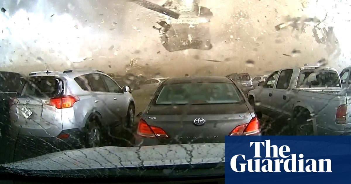 Dashcam footage captures tornado destroying Nebraska building – video
