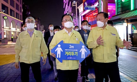 South Korean PM Kim Boo-kyum takes part in a social distancing campaign against the coronavirus in western Seoul