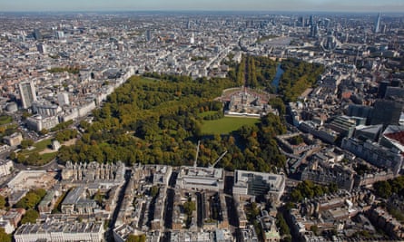 An aerial view of London looking east with Buckingham Palace, Green Park and St James’s Park visible.