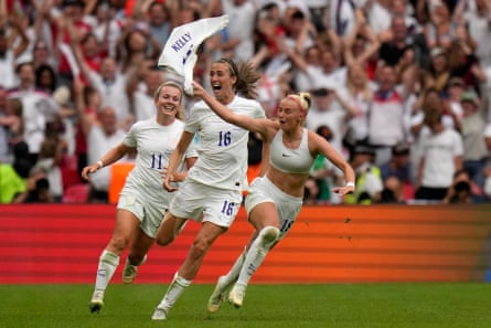 Chloe Kelly rips her shirt off as she runs to celebrate the winner.