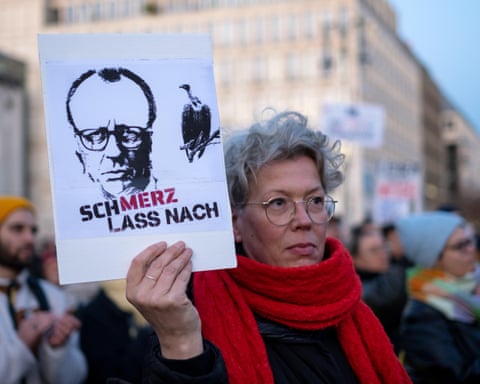 Protesters march against Friedrich Merz's cityscape remark in front of the Brandenburg Gate in Berlin