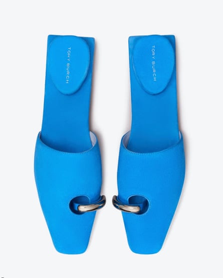 A pair of bright-blue sandals with silver ring buckles and an inverted heel, viewed from above